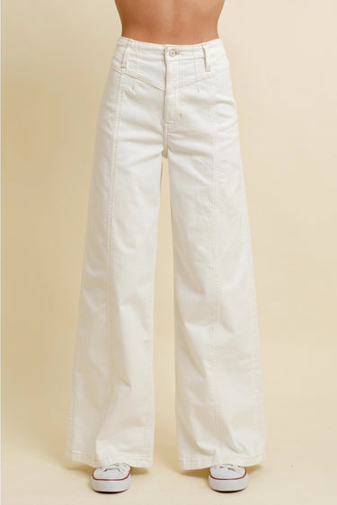 Nurcia Jeans full front view showing high-rise waist and wide-leg silhouette in clean off-white denim with relaxed straight drape