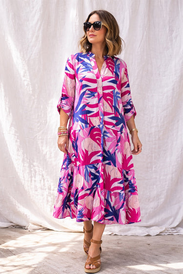 Nusa Maxi Dress vibrant tropical print maxi dress on model full body front view showing flowy silhouette, lightweight fabric, and relaxed summer fit