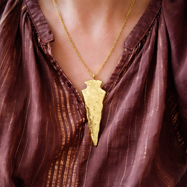 Nuvo Necklace gold arrowhead pendant necklace worn on model layered styling.
