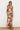 Otti Maxi Dress strapless leaf print maxi dress full-length front view on model.