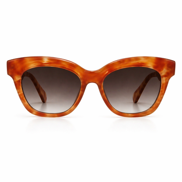 Palais Sunglasses with cat-eye frame in translucent amber tortoiseshell acetate and brown gradient lenses, featuring an upswept retro-inspired silhouette.