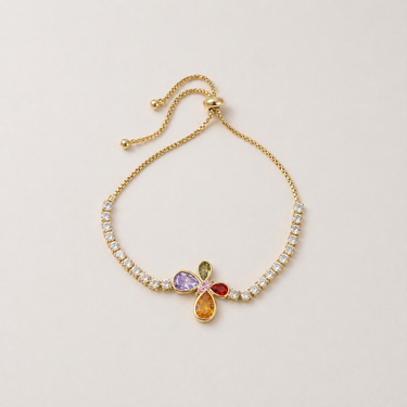 Plar Bracelet gold filled bracelet with shimmering stones and colorful multi-tone charm on neutral background, showing adjustable chain and delicate design