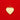 Pola Pendant gold heart charm with clear zirconia stones on a polished surface, photographed on a bold red background