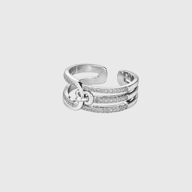 A gold-plated silver ring with open band design and sparkling crystal accents, displayed on a white surface.