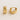 Close-up of Renne Huggie Earrings highlighting smooth curved surface and hinge closure