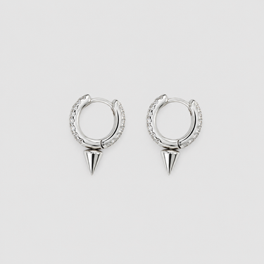 Silver hoop earrings with cone-shaped accents on a light gray background