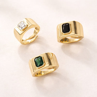 Sakura Ring gold signet style ring with faceted center stone available in green, black, or clear stones bold statement ring on neutral background