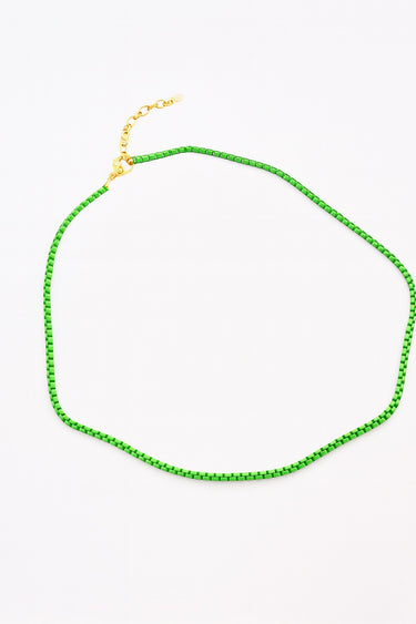 Close-up of the Samura Necklace in mint enamel and gold plated chain by Matte. A minimal, lightweight accessory perfect for layering or wearing solo. Modern summer jewelry.