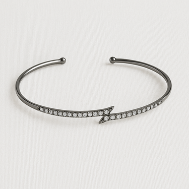 Seris Cuff Bracelet — slim open gunmetal cuff bracelet with arrow pavé detail on white background, minimalist jewelry by Matte.