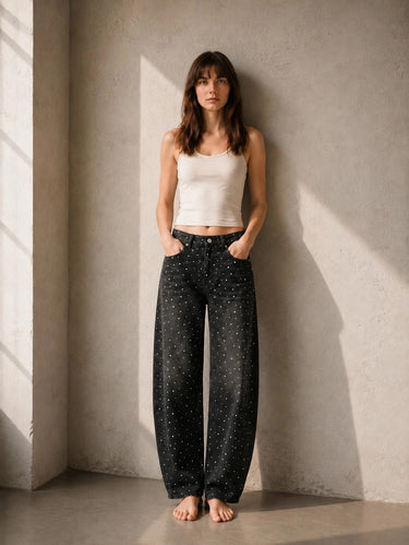 Shimi Jean by Matte in black denim with allover rhinestone detailing, relaxed wide-leg fit and high-rise waist, front view on model.