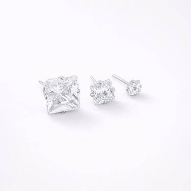 Sient Stud Earrings silver version close-up showing small and medium size crystal studs with polished silver settings and brilliant zirconia stones
