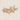 Sierra Hair Clip — gold hair accessory with two crystal stars on soft neutral background.
