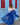 Matte royal blue sheer scarf styled by a woman in front of a light blue doorway, showcasing its lightweight, flowing texture and oversized design.