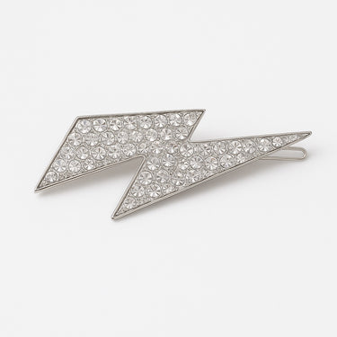 Silver lightning bolt brooch with crystal embellishments on a white background