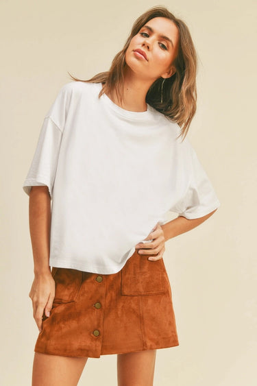 Toto Crop Top front view on model wearing oversized white crewneck tee.
