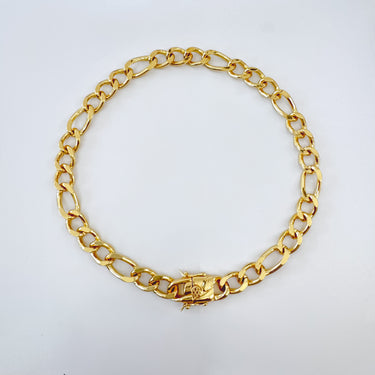 A chunky gold-filled chain necklace with a gold-tone clasp, displayed against a white background.