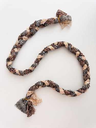 Twilight Sequin Rope Necklace displayed on white backdrop, braided rope with gold, bronze, and charcoal sequins, statement jewelry by Matte