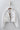 White cropped utility jacket with drawstring hem and front pockets.
