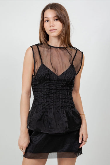 Wada Top worn by model, front view, highlighting corset-style ruching and sheer mesh detail