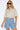 Wims Cropped Shirt worn by model, front view, featuring relaxed short sleeves, button-front design, and elasticated hem.
