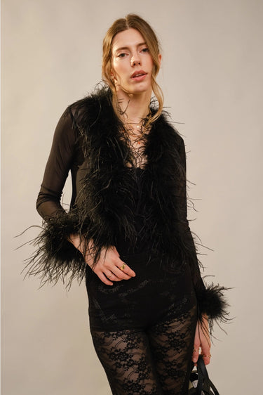 Yanz Mesh Top sheer feather-trim top styled with black pants full outfit.