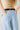 Zaria Jeans detail view of light-wash denim fabric and relaxed fit