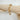 Adeline gold chunky link bracelet on wood display