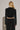 Back view of Akima Pant showing soft velvet texture and fluid fit.