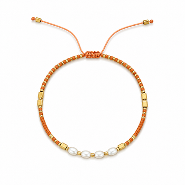 Amatilde Bracelet with terracotta beads, pearl accents, gold details, and adjustable sliding closure.
