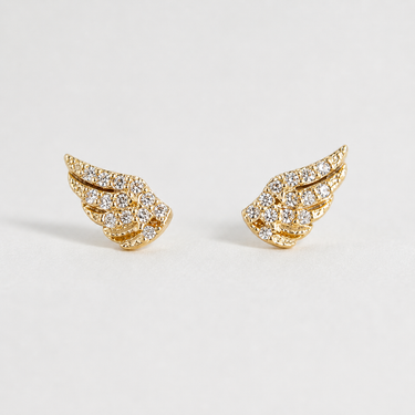 Amel Stud Earrings gold wing-shaped crystal stud earrings with pavé detailing on white background.