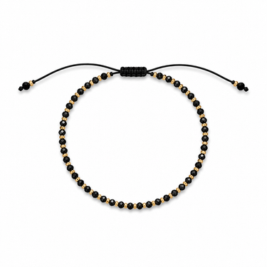 Amurk Bracelet featuring polished black round beads with gold-tone accent beads on an adjustable black sliding cord closure.