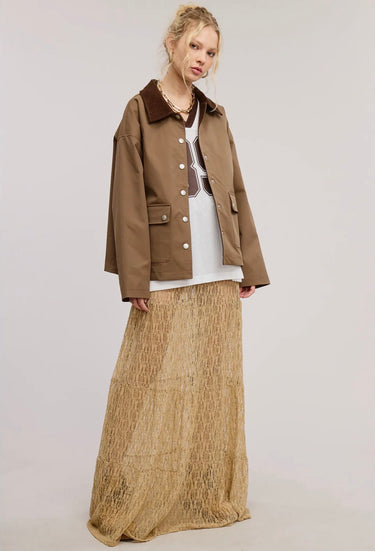 Full-length front view of the Aspen Utility Jacket showcasing the oversized fit, mocha brown color, snap-button closure, utility pockets, and relaxed everyday styling.
