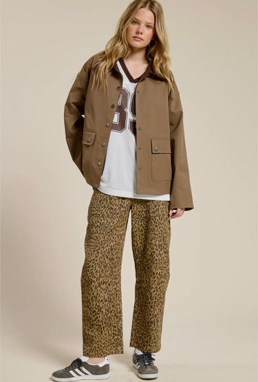 Front view of the Aspen Utility Jacket highlighting the oversized silhouette, structured utility design, long sleeves, and versatile mocha fabric.