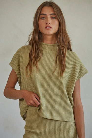 Barbara Top oversized waffle knit cap sleeve top in sage green styled with matching skirt.