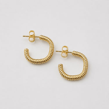Be Hoop Earrings featuring polished gold-plated hoop earrings with a fine ribbed rope texture, rounded classic hoop silhouette, high-shine finish, lightweight design, secure post-back closure, and an elegant everyday style.