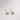 Bellota Stud Earrings pearl studs on neutral background, showing round pearl design and gold post detail.