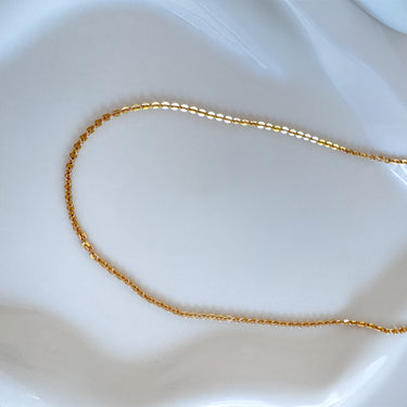 Bilbao gold chain necklace by Matte displayed on white background, delicate everyday jewelry