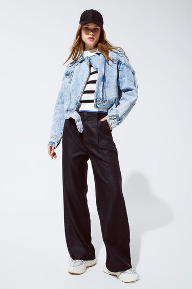 Model wearing Lisboa Pants with striped knit and denim jacket.