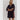 Model wearing black Krewer Dress with puff sleeves and relaxed mini silhouette.