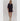 Model wearing black Krewer Dress with puff sleeves and relaxed mini silhouette.