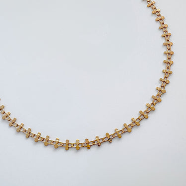 Caeli gold plated geometric chain necklace on white background