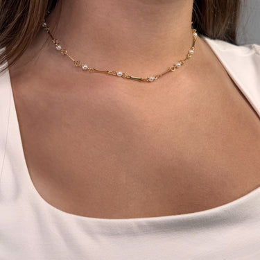 Model wearing Calypsa Necklace by Matte, gold plated with delicate 4mm pearls