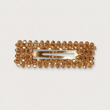 Canelle Hair Clip rectangular shape with gold crystals on white background, elegant accessory photo for Matte.