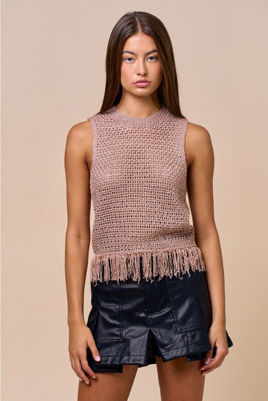 Clotet Top sleeveless neutral crochet-style top worn with black ruffle shorts, showing open-knit texture, straight fit, and fringe hem.