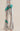 Silver sequin pants with green and red lightning bolt detail