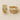 Champagne-gold pavé huggie earrings with micro-crystal detailing on white linen backdrop, Dessidere Huggie Earrings.