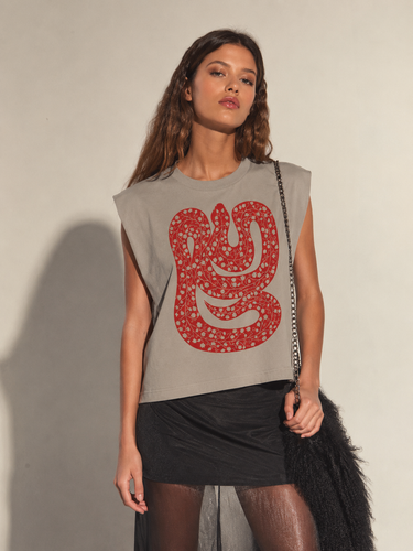 Model wearing the Drumar Graphic Tee in mocha showcasing the oversized vintage snake graphic, cropped relaxed fit, structured shoulders, and casual everyday styling.
