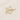 Gold star-shaped hair clip with pearls on a beige background