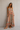 Woman wearing the Eloisa floral maxi dress featuring a tiered silhouette, adjustable tie straps, and a flowing lightweight fabric.