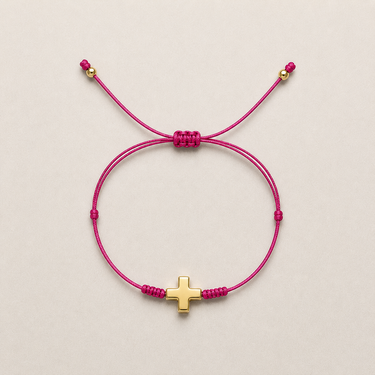 Faith Bracelet pink adjustable cord bracelet with gold-tone cross charm.